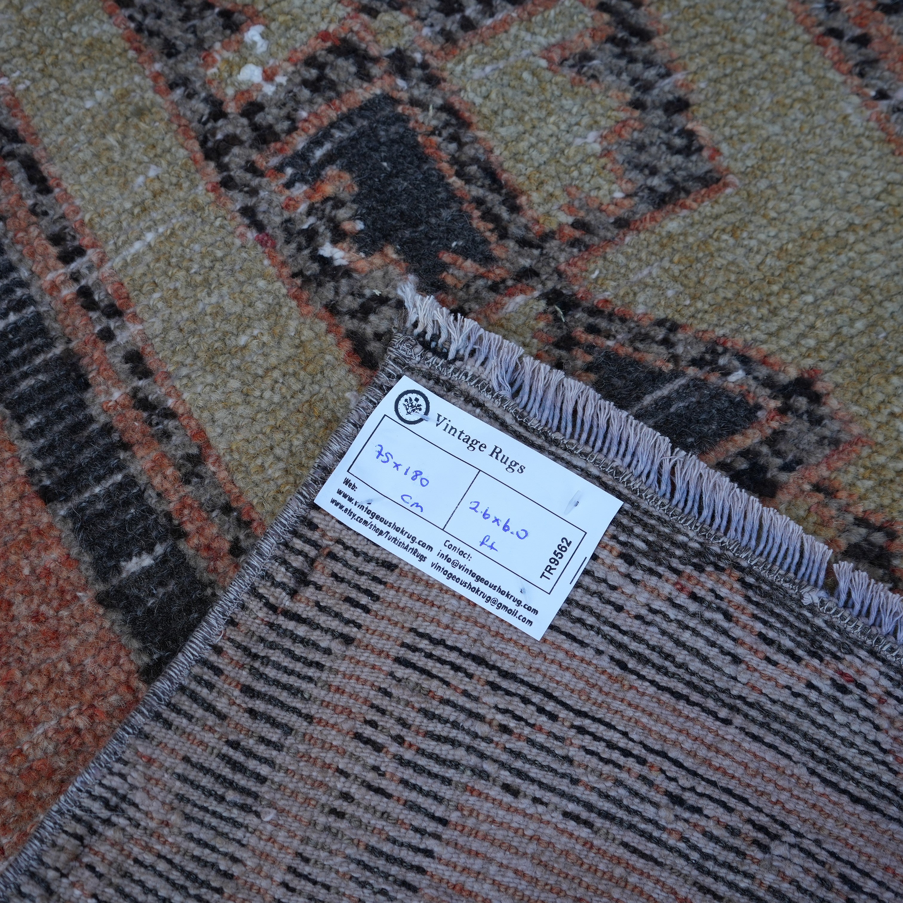 Orange 2' x 6' vintage Turkish mini runner from the 1970s with traditional design.