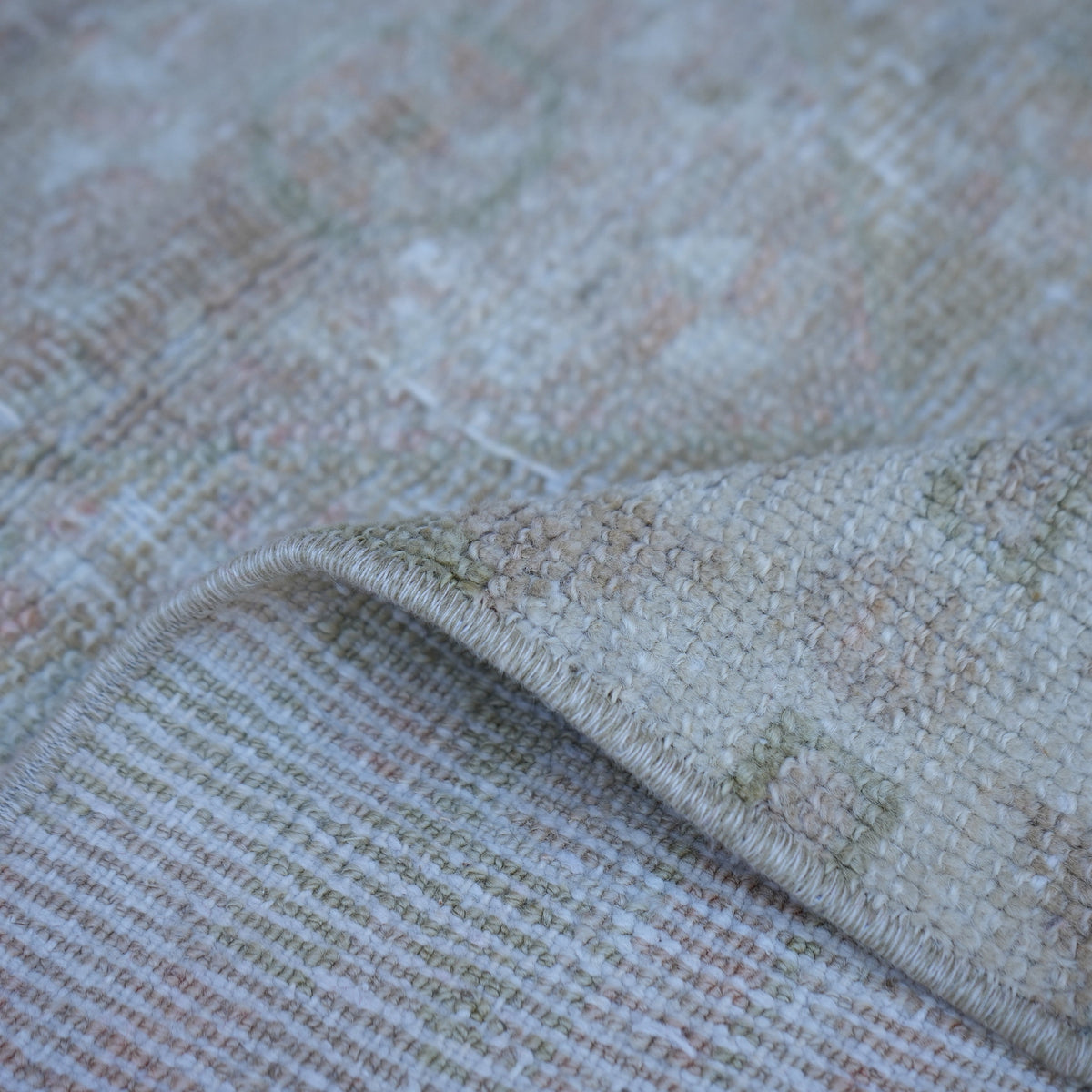 Additional view of the pink vintage Turkish neutral rug, hand-knotted in wool and cotton.