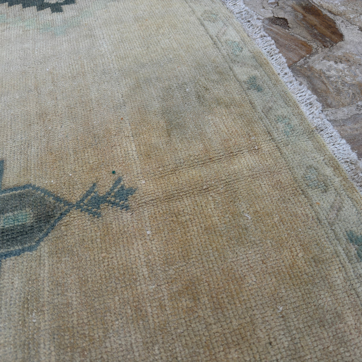 1970s beige vintage Turkish neutral wool rug with neutral design, hand-knotted weave and low pile.