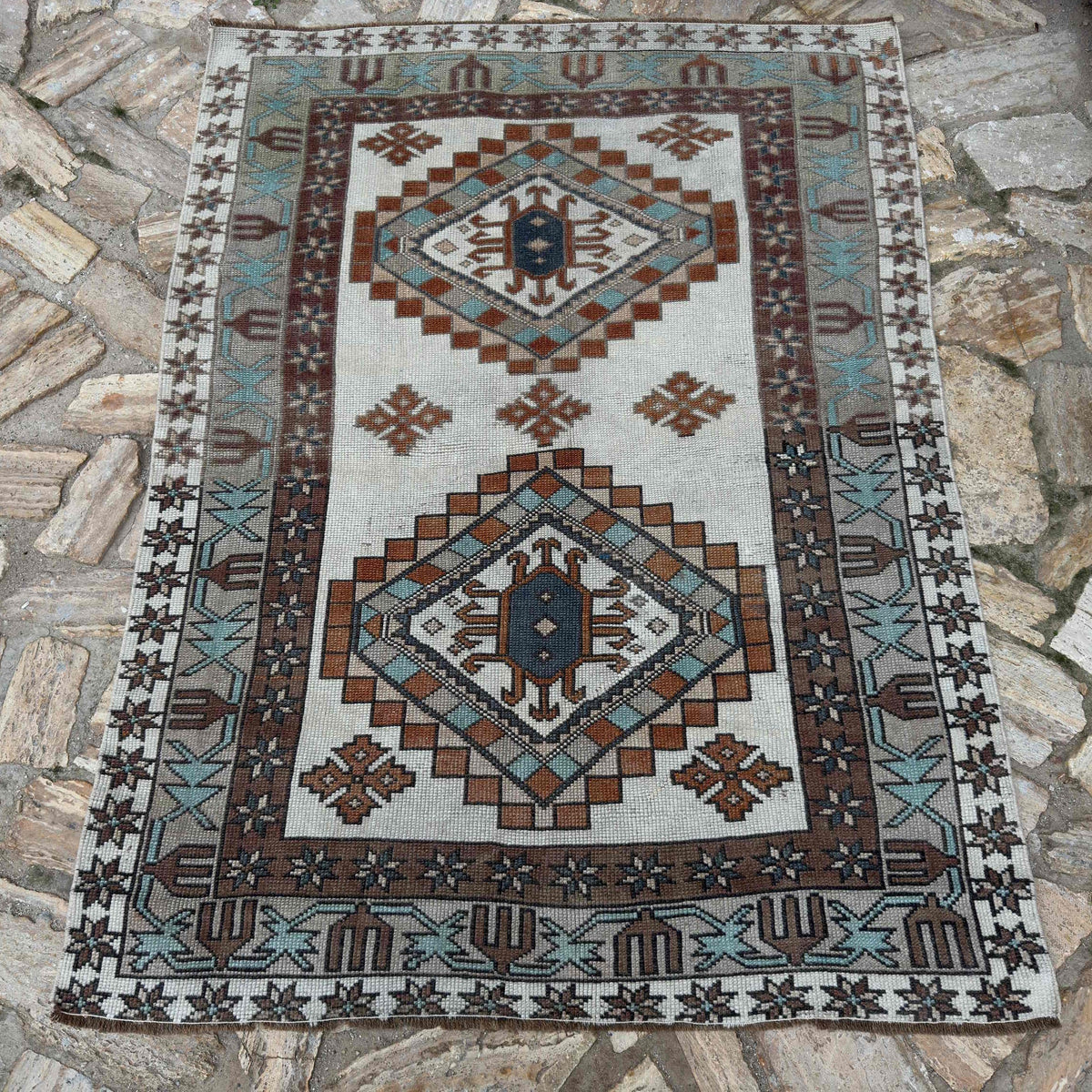 Brown 4' x 5' vintage Turkish oushak rug in wool and cotton, shown on the floor.