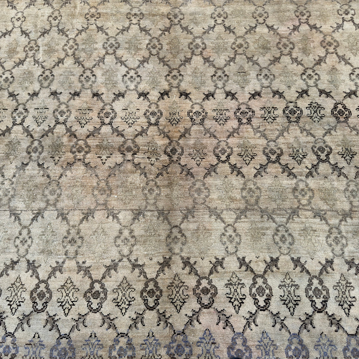 1970s beige vintage Turkish oushak rug with floral design, hand-knotted weave and low pile.