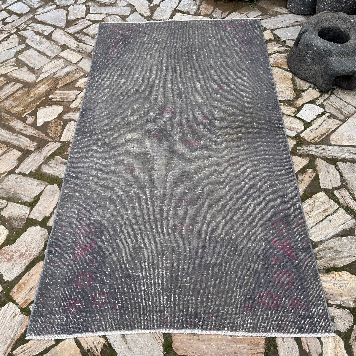 Gray 4' x 7' vintage Turkish overdyed rug in wool and cotton, shown on the floor.