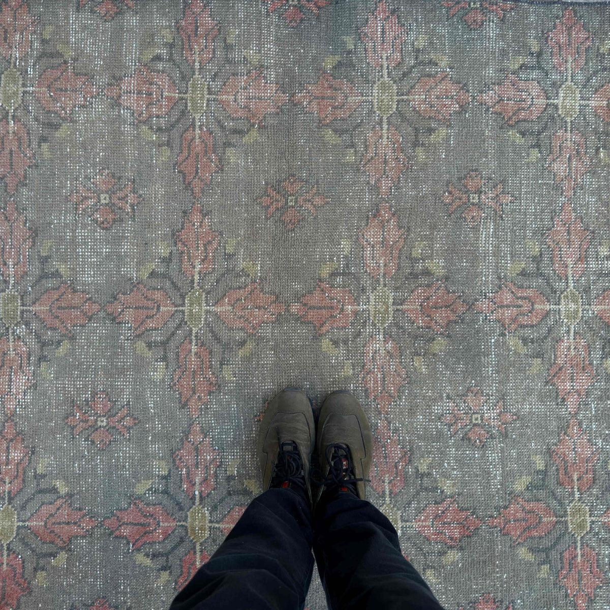 1970s gray vintage Turkish overdyed rug with traditional design, hand-knotted weave and low pile.