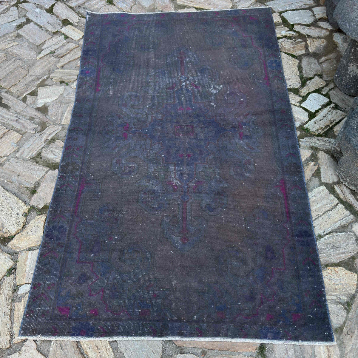 Grey 4' x 7' vintage Turkish overdyed rug in wool and cotton, shown on the floor.
