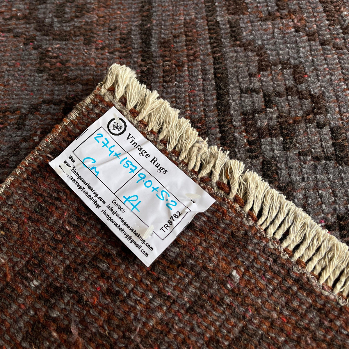 Gray 5' x 9' vintage Turkish overdyed rug in wool and cotton, shown on the floor.