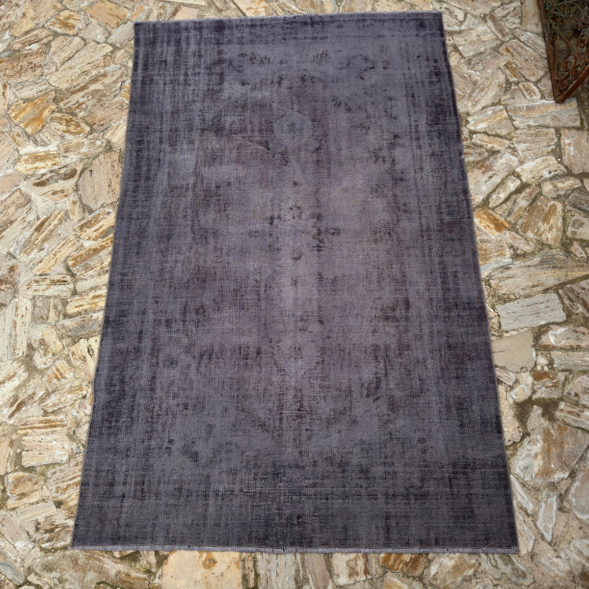 Gray 6' x 10' vintage Turkish overdyed rug in wool and cotton, shown on the floor.