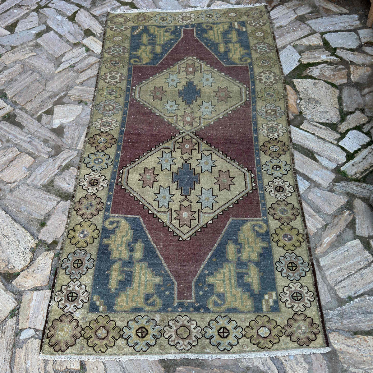 Red 4' x 7' vintage Turkish persian rug in wool and cotton, shown on the floor.