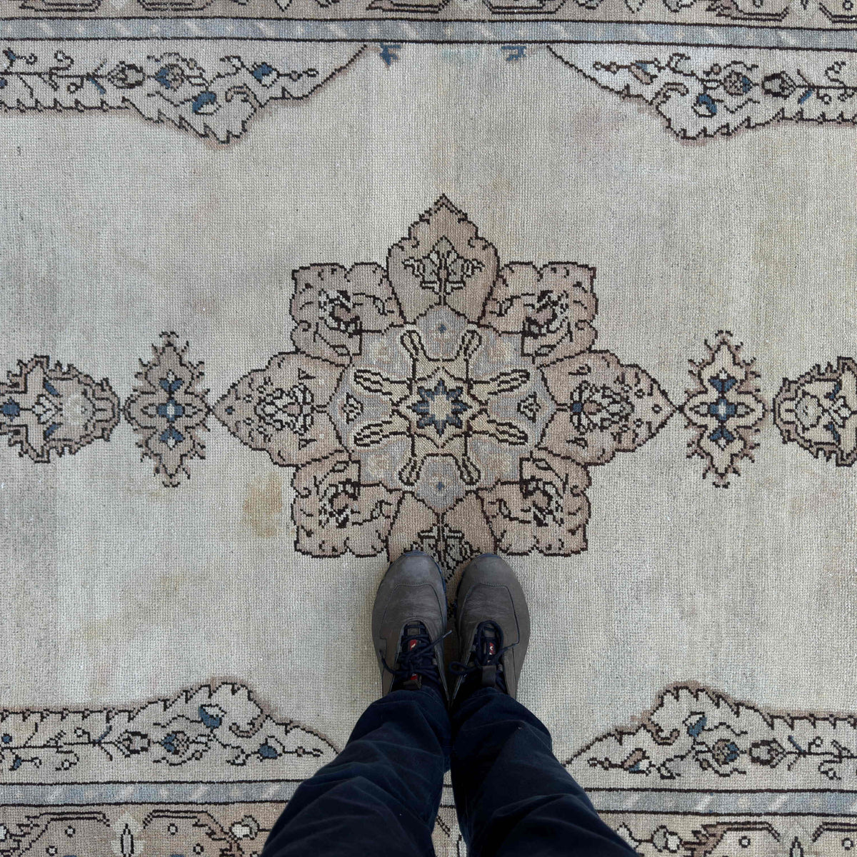 1970s beige vintage Turkish persian rug with neutral design, hand-knotted weave and low pile.