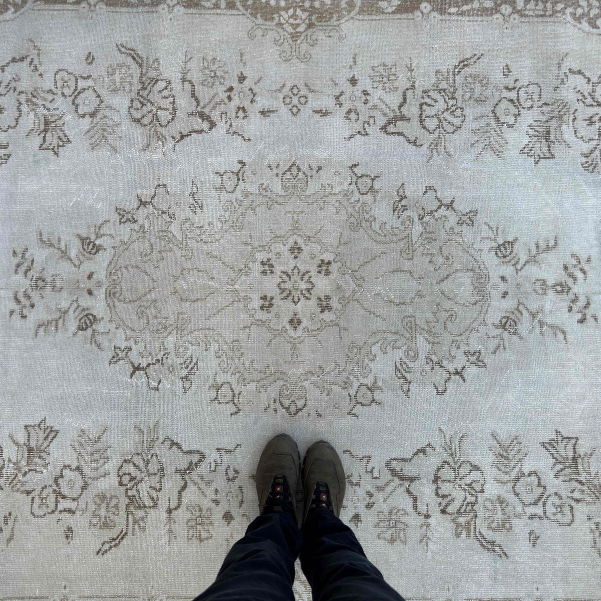 1970s beige vintage Turkish persian rug with neutral design, hand-knotted weave and low pile.