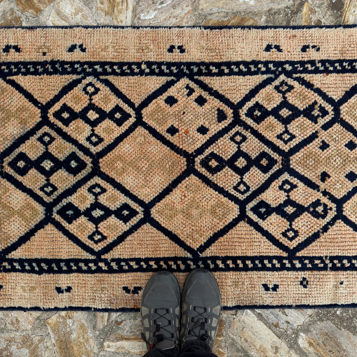 1970s pale orange vintage persian runner rug with traditional design, hand-knotted weave and low pile.