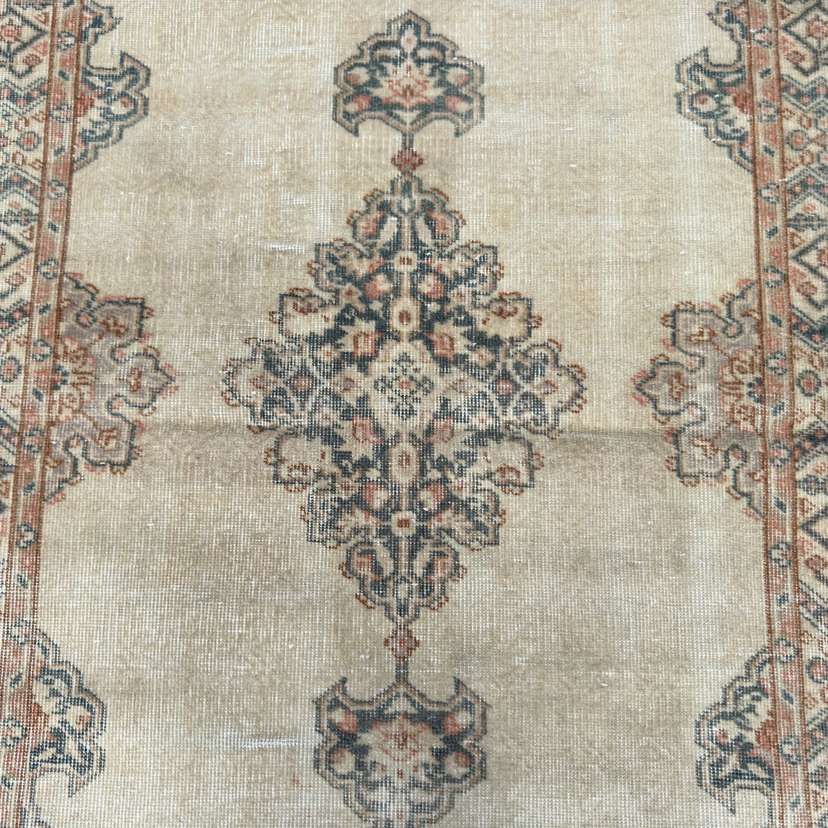 1970s beige vintage Turkish persian style rug with medallion design, hand-knotted weave and low pile.