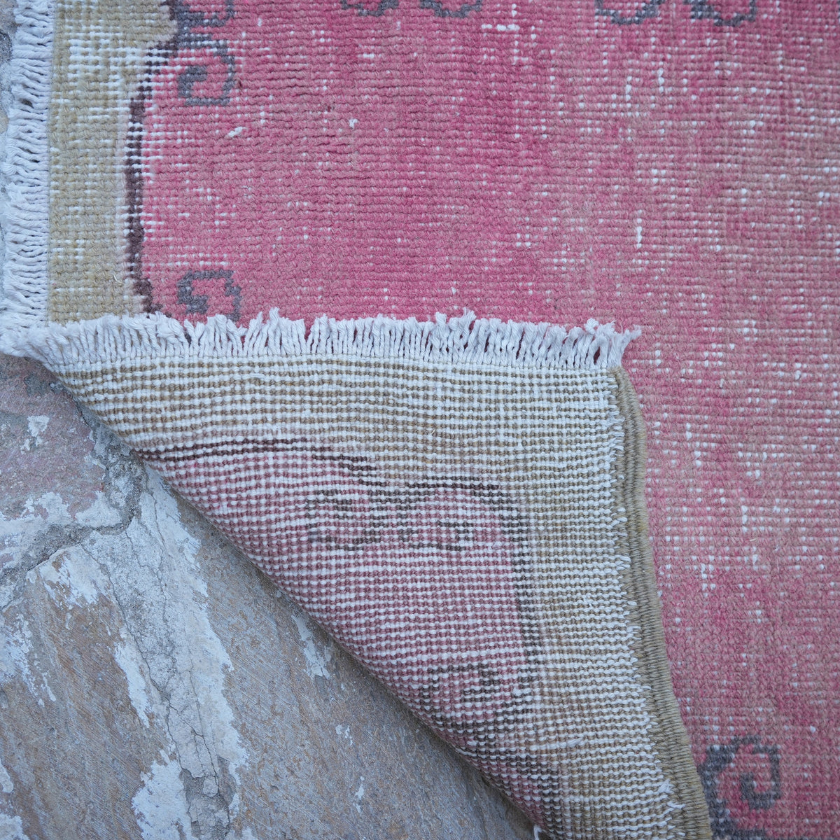 1970s pink vintage Turkish runner rug with traditional design, hand-knotted weave and low pile.