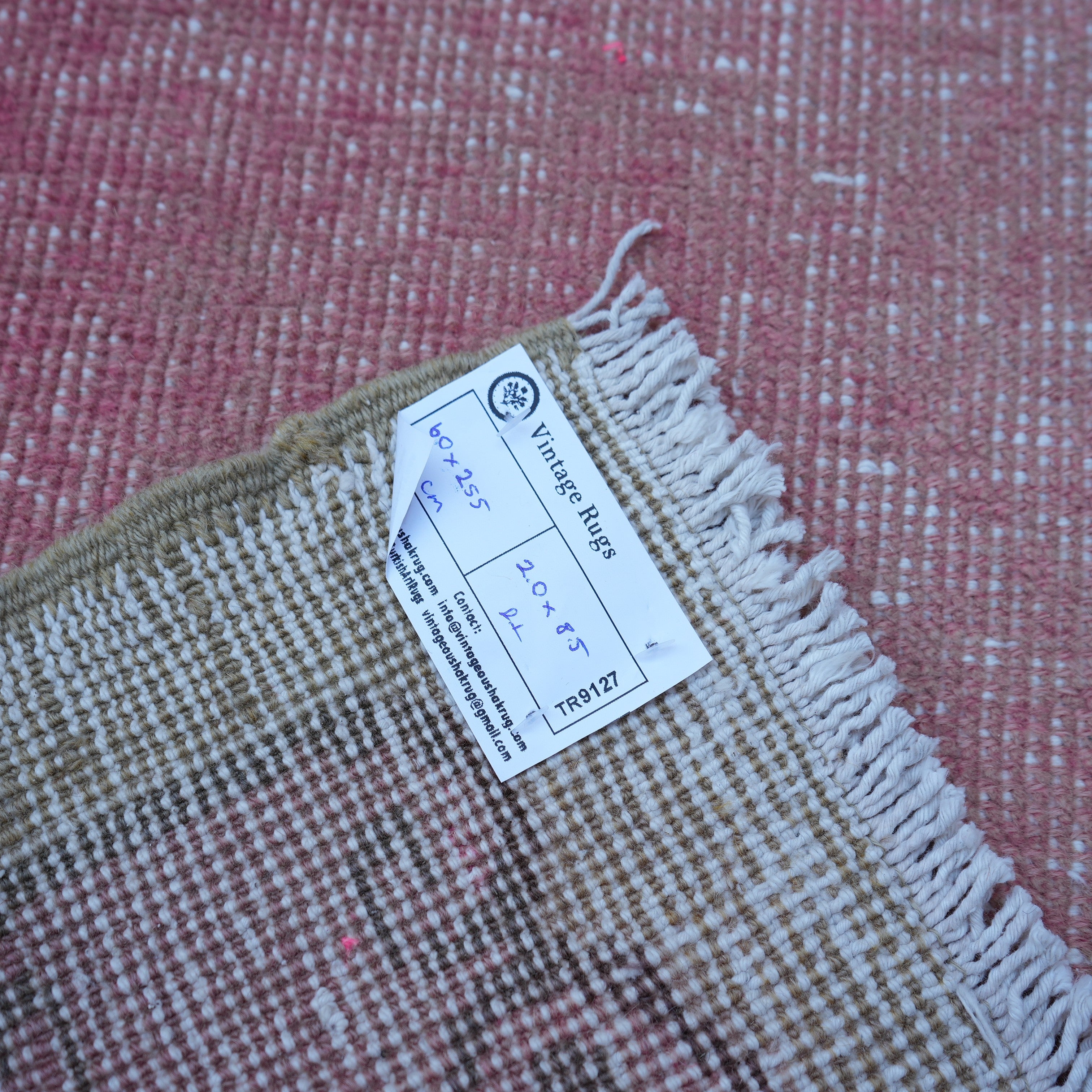 Pink 2' x 8' vintage Turkish runner rug from the 1970s with traditional design.