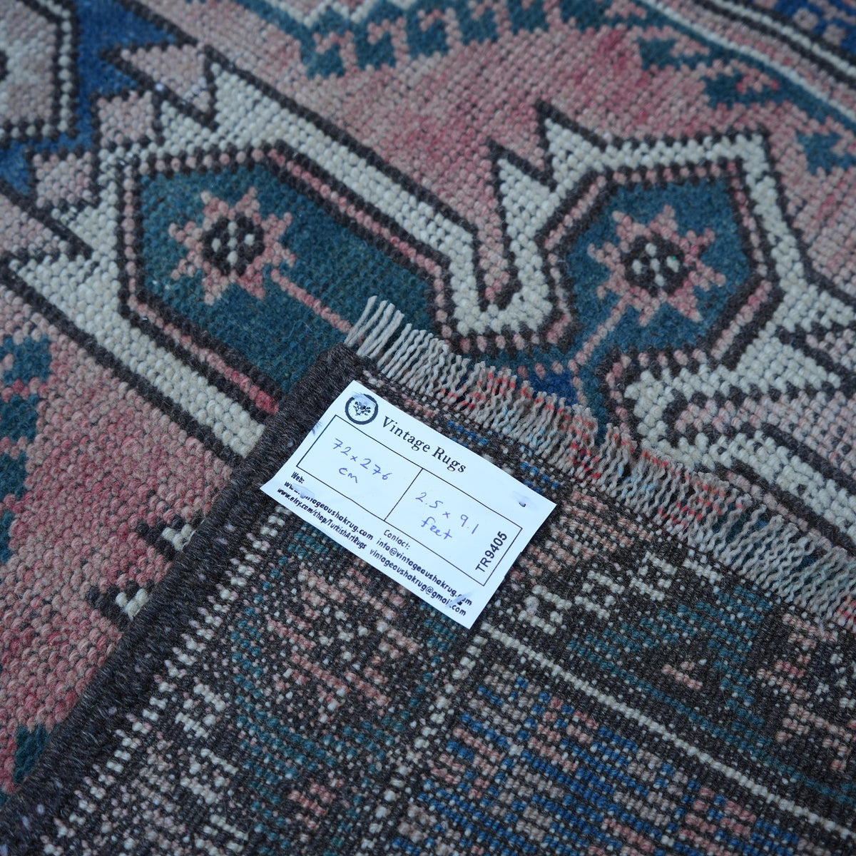 Red 2' x 9' vintage Turkish runner rug from the 1970s with traditional design.