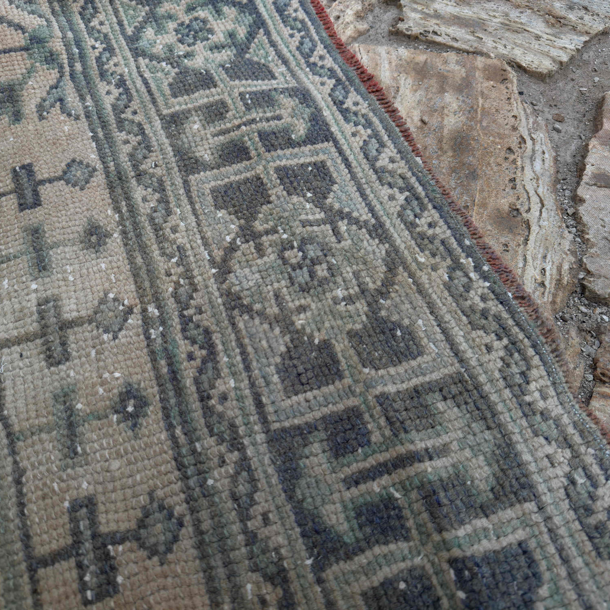 Close-up of the beige vintage Turkish runner rug showing traditional details, hand-knotted weave, wool and cotton and low pile.