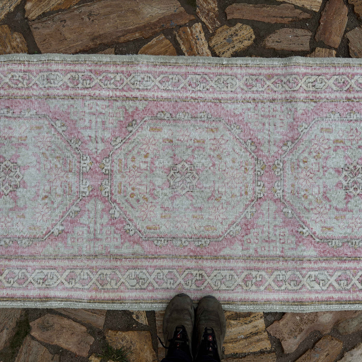 1970s pale pink vintage Turkish runner rug with neutral design, hand-knotted weave and low pile.
