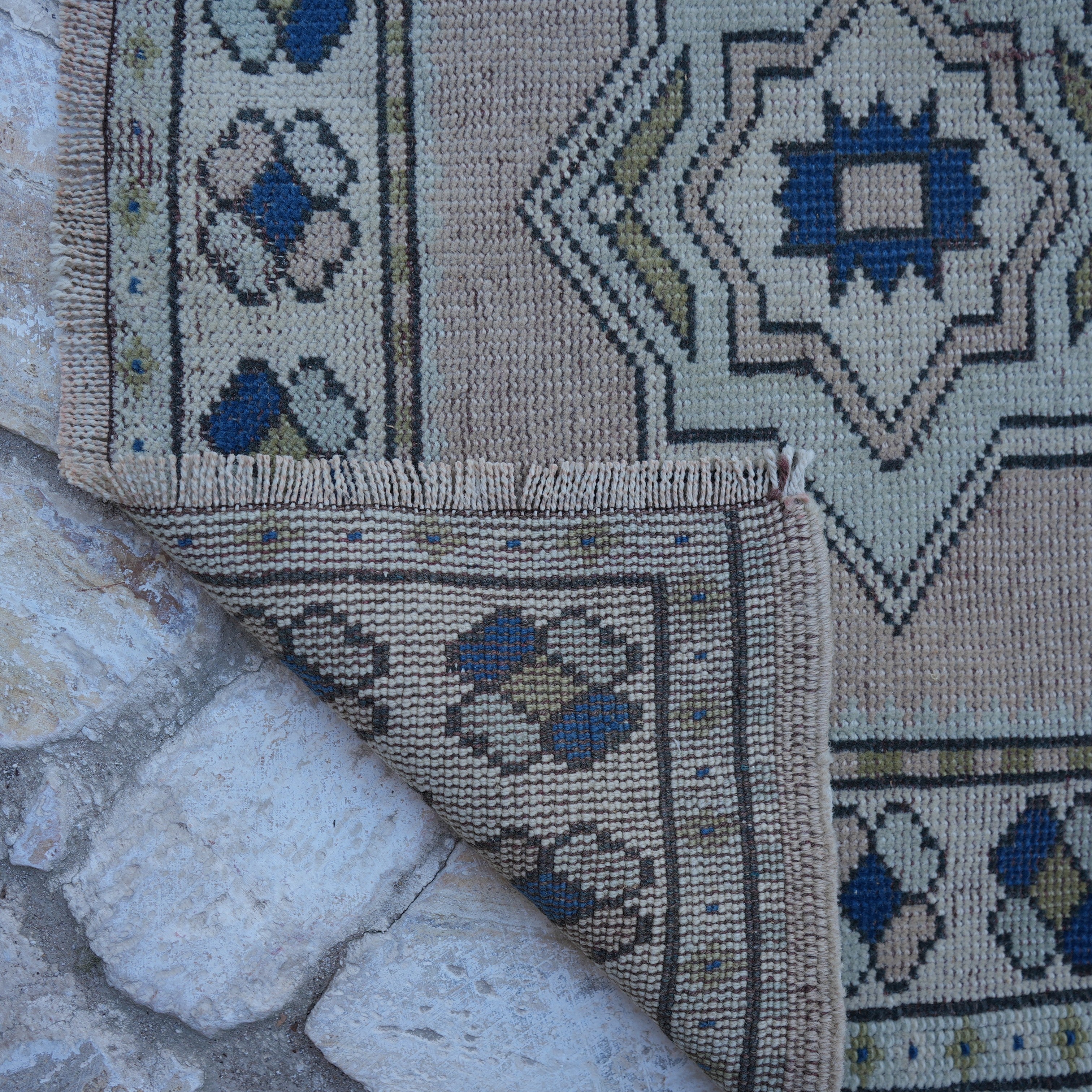 1970s pale pink vintage Turkish runner rug with traditional design, hand-knotted weave and low pile.