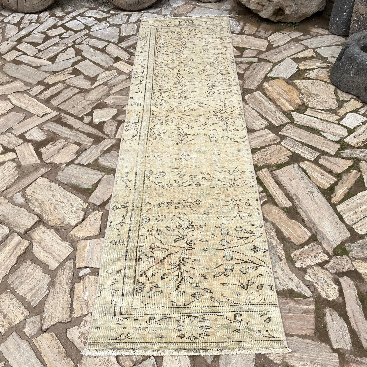Beige 3' x 9' vintage Turkish runner rug in wool and cotton, shown on the floor.