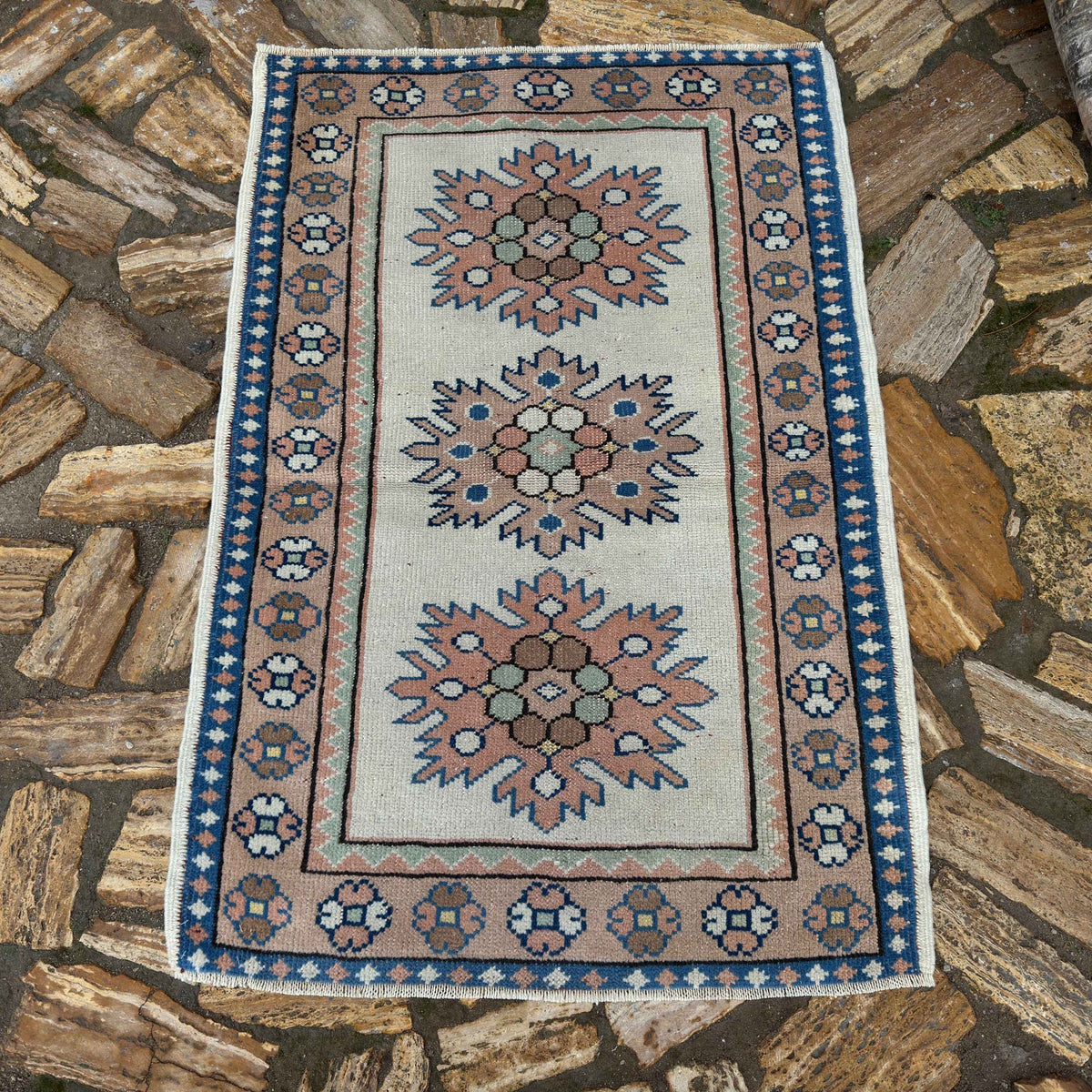 Beige 3' x 4' vintage Turkish small rug in wool and cotton, shown on the floor.