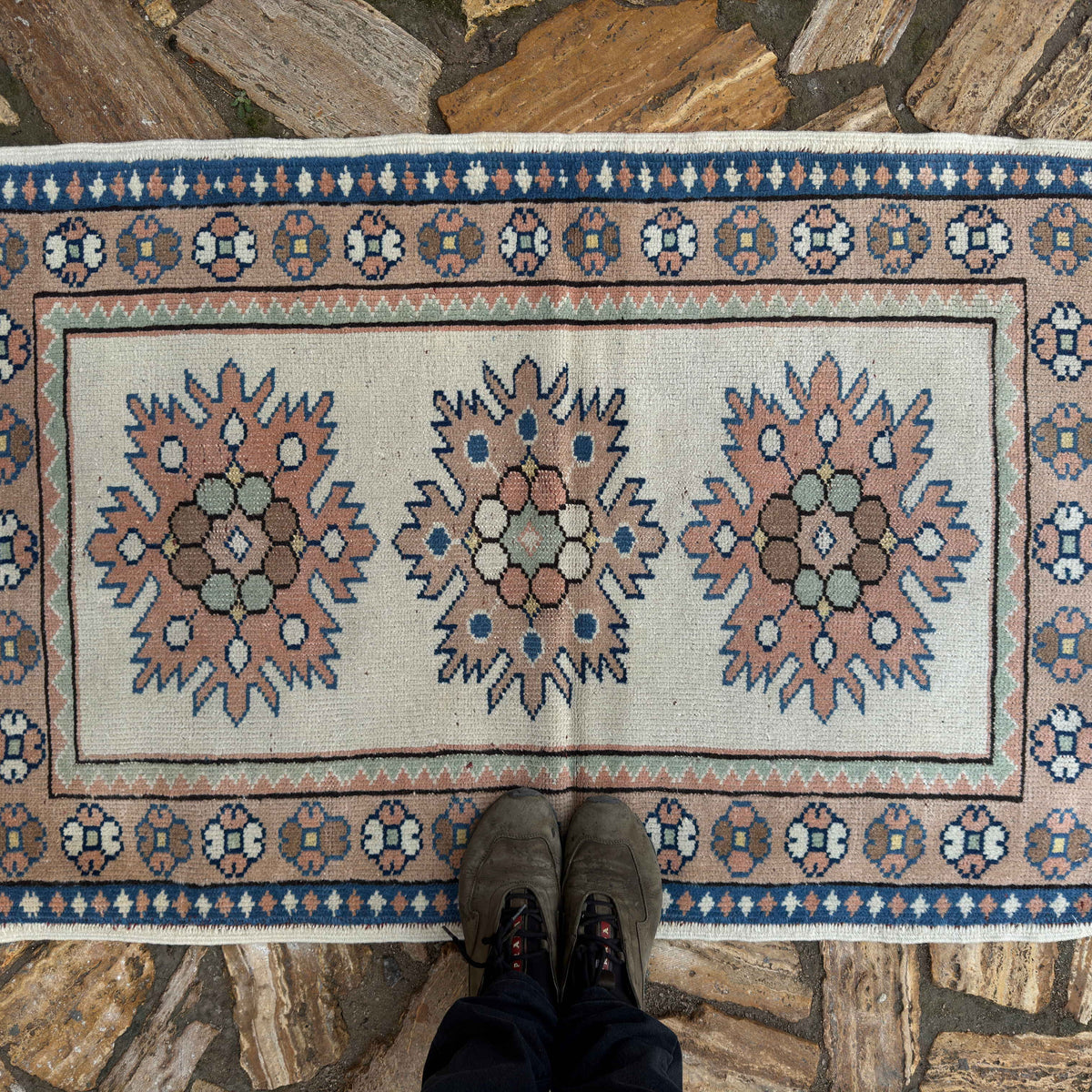 1970s beige vintage Turkish small rug with traditional design, hand-knotted weave and low pile.