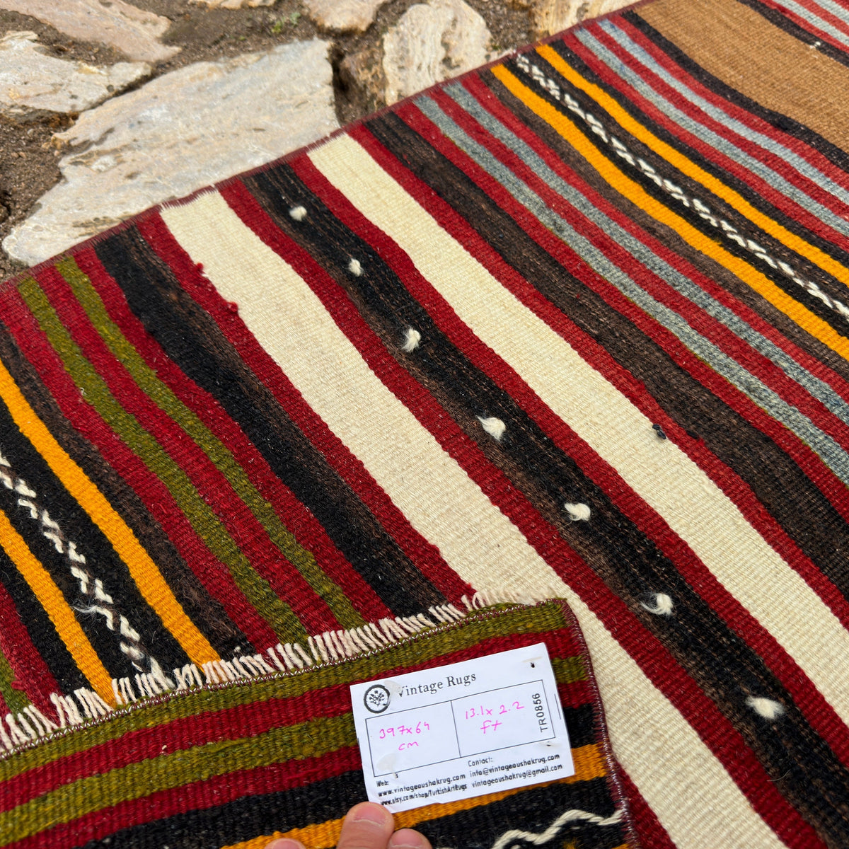 Close-up of the red vintage Turkish striped runner rug showing striped details, flatweave construction, wool and cotton and low pile.