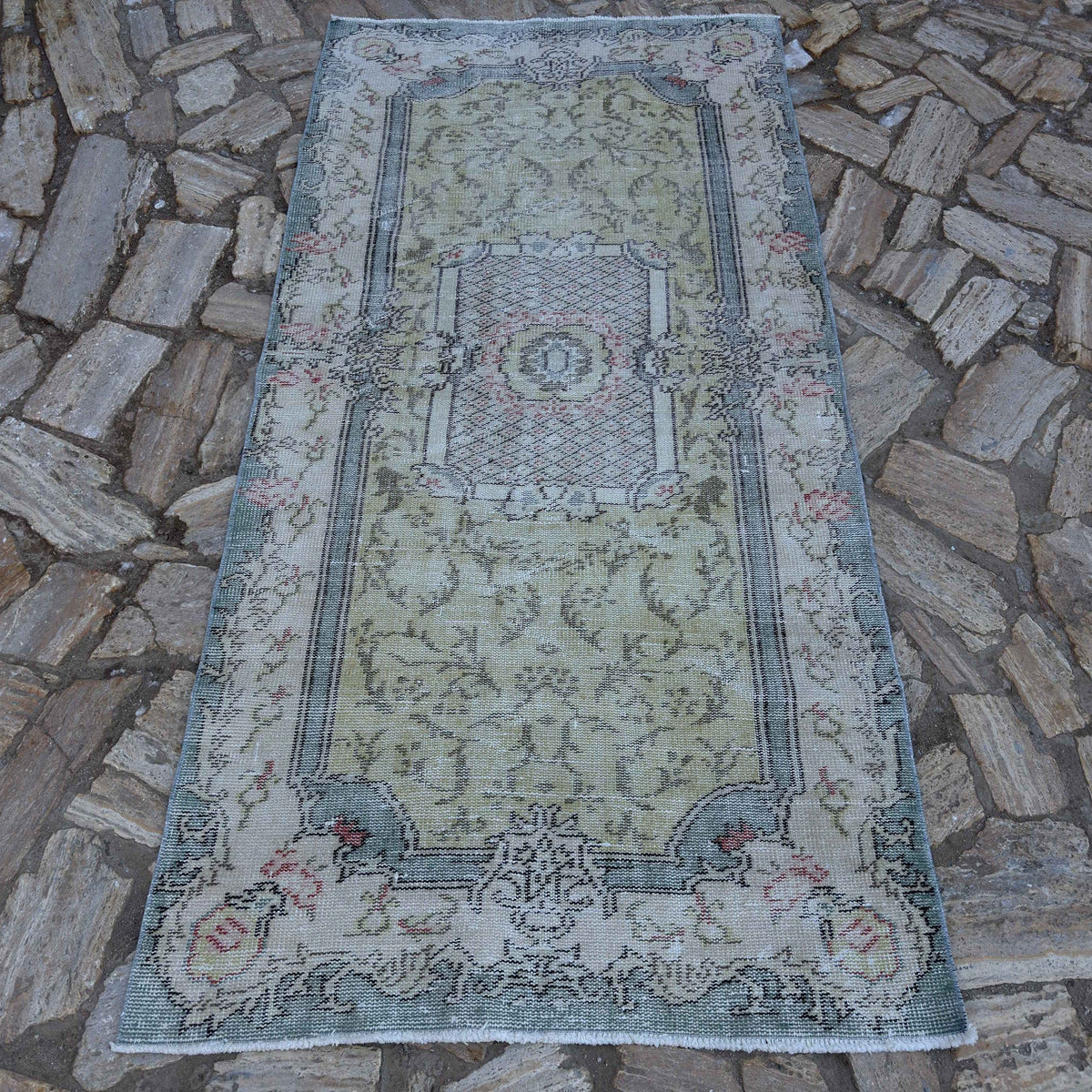 Pale Green 4' x 7' vintage Turkish traditional rug in wool and cotton, shown on the floor.