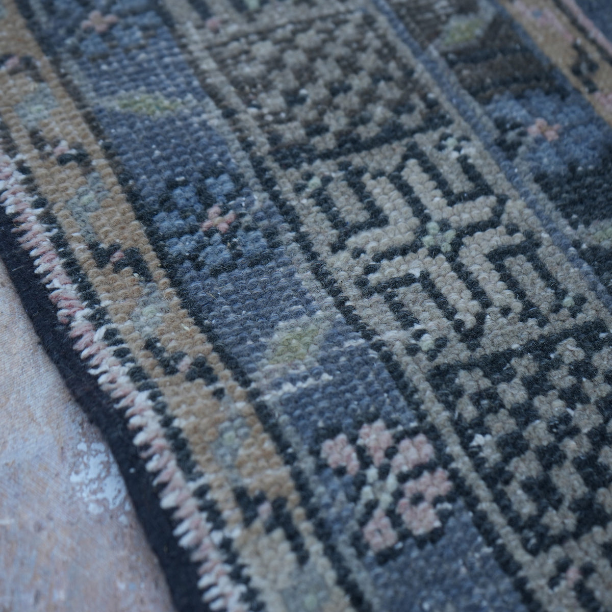 Pink 5' x 10' vintage Turkish traditional rug in wool and cotton, shown on the floor.