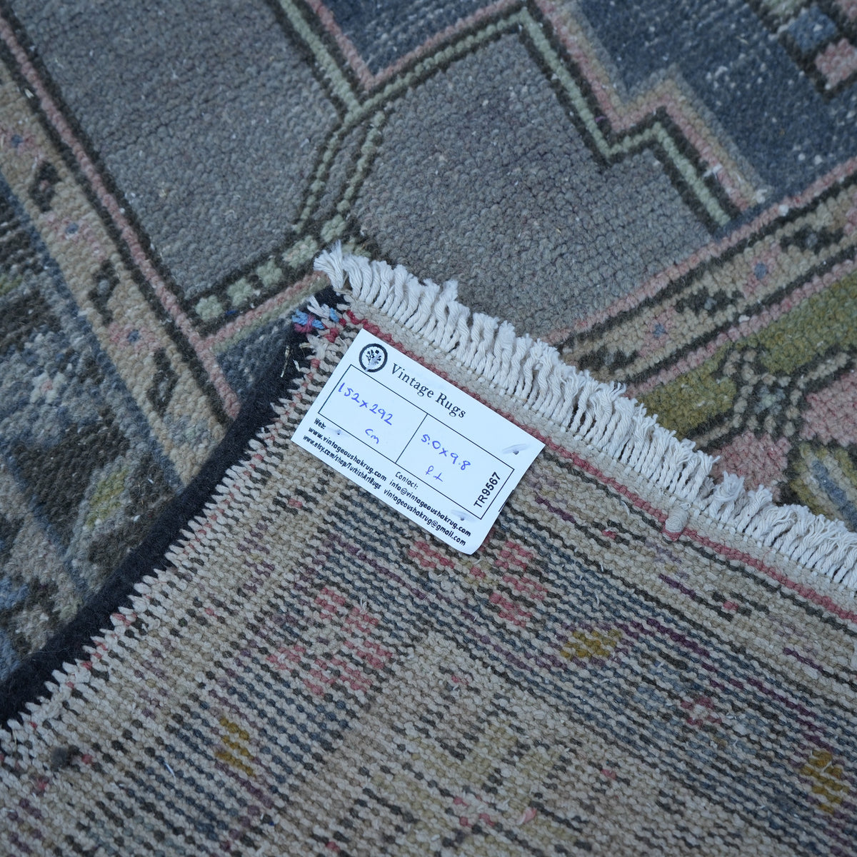 Pink 5' x 10' vintage Turkish traditional rug from the 1970s with traditional design.