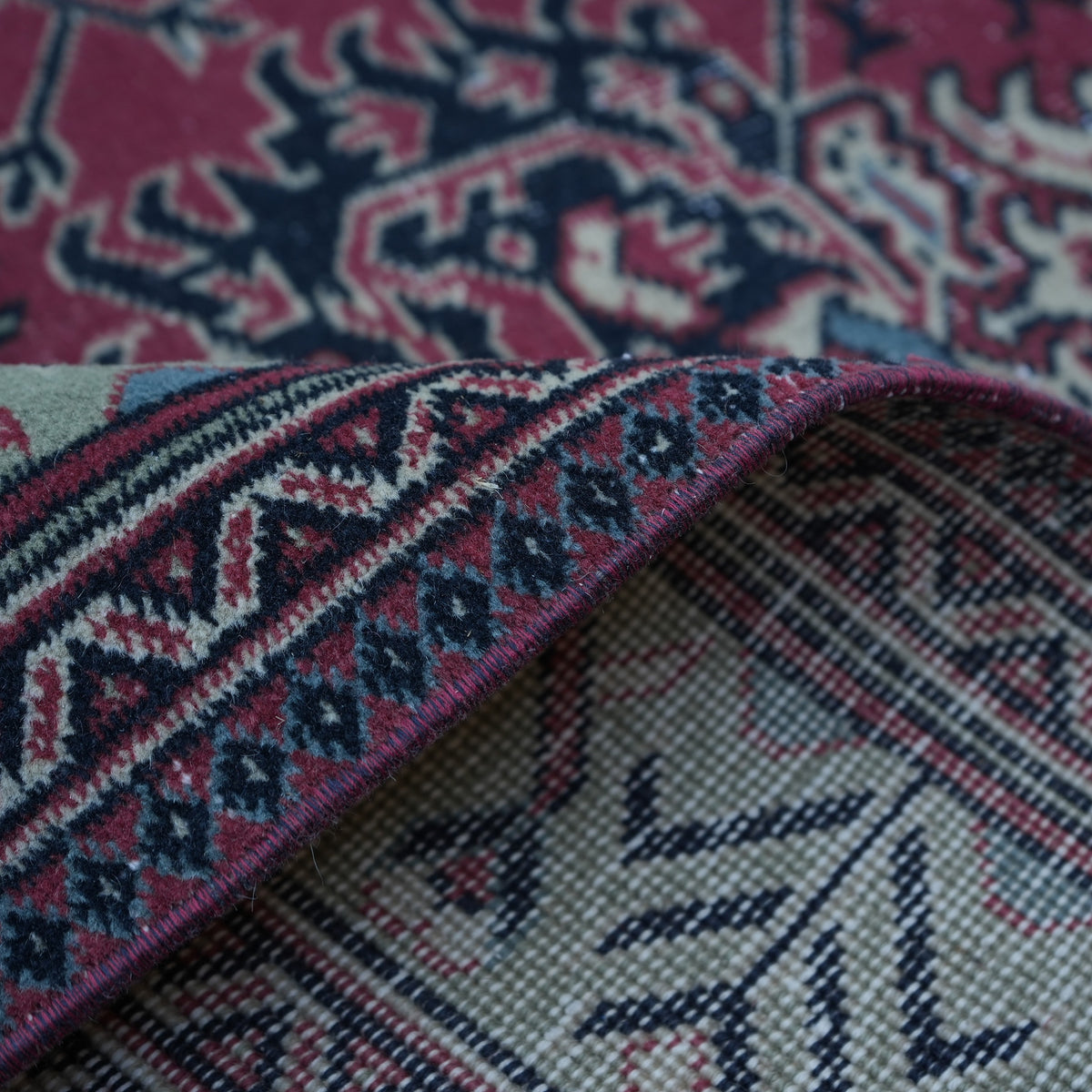 Additional view of the red vintage Turkish traditional rug, hand-knotted in wool and cotton.