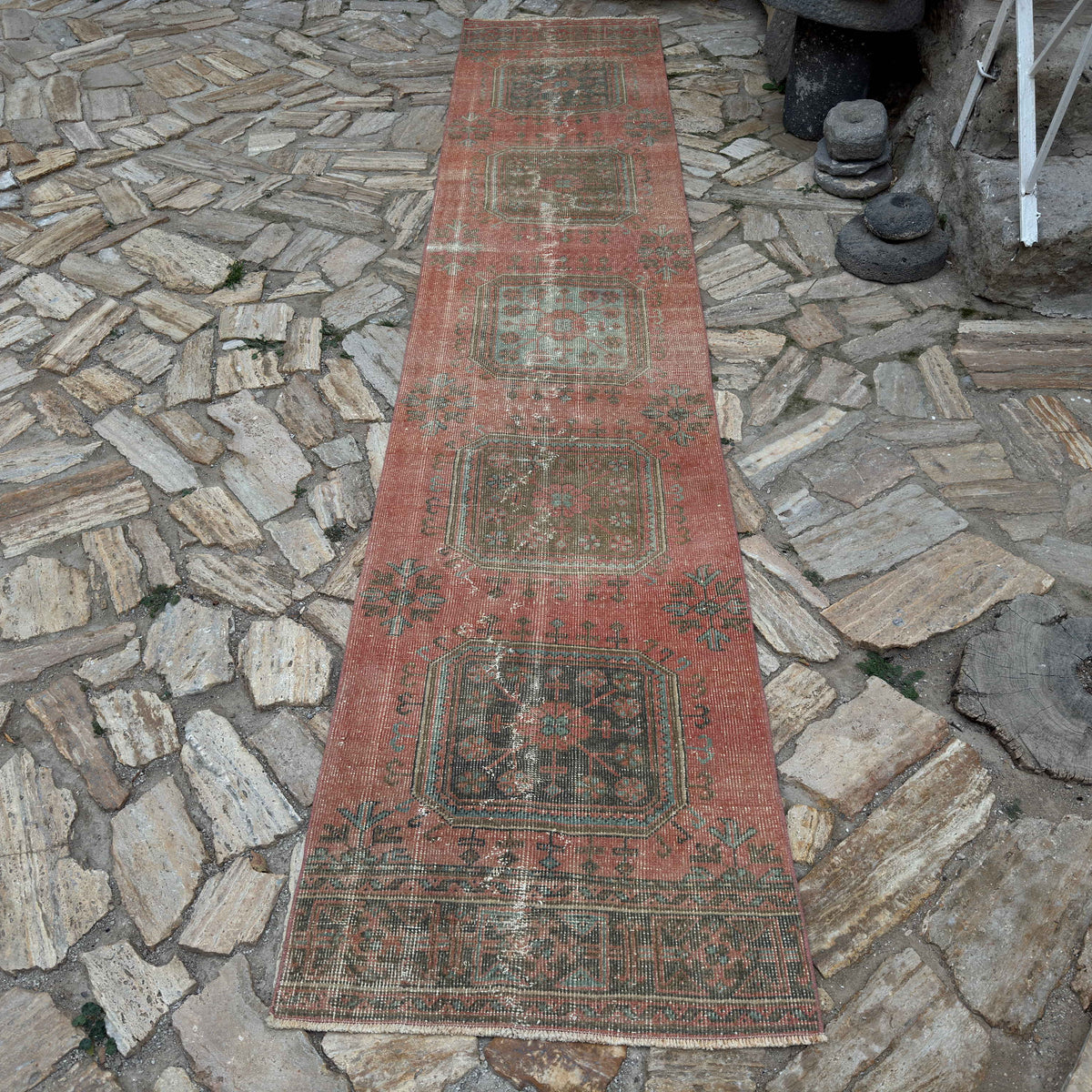 Pale Red 3' x 13' vintage Turkish traditional runner rug in wool and cotton, shown on the floor.