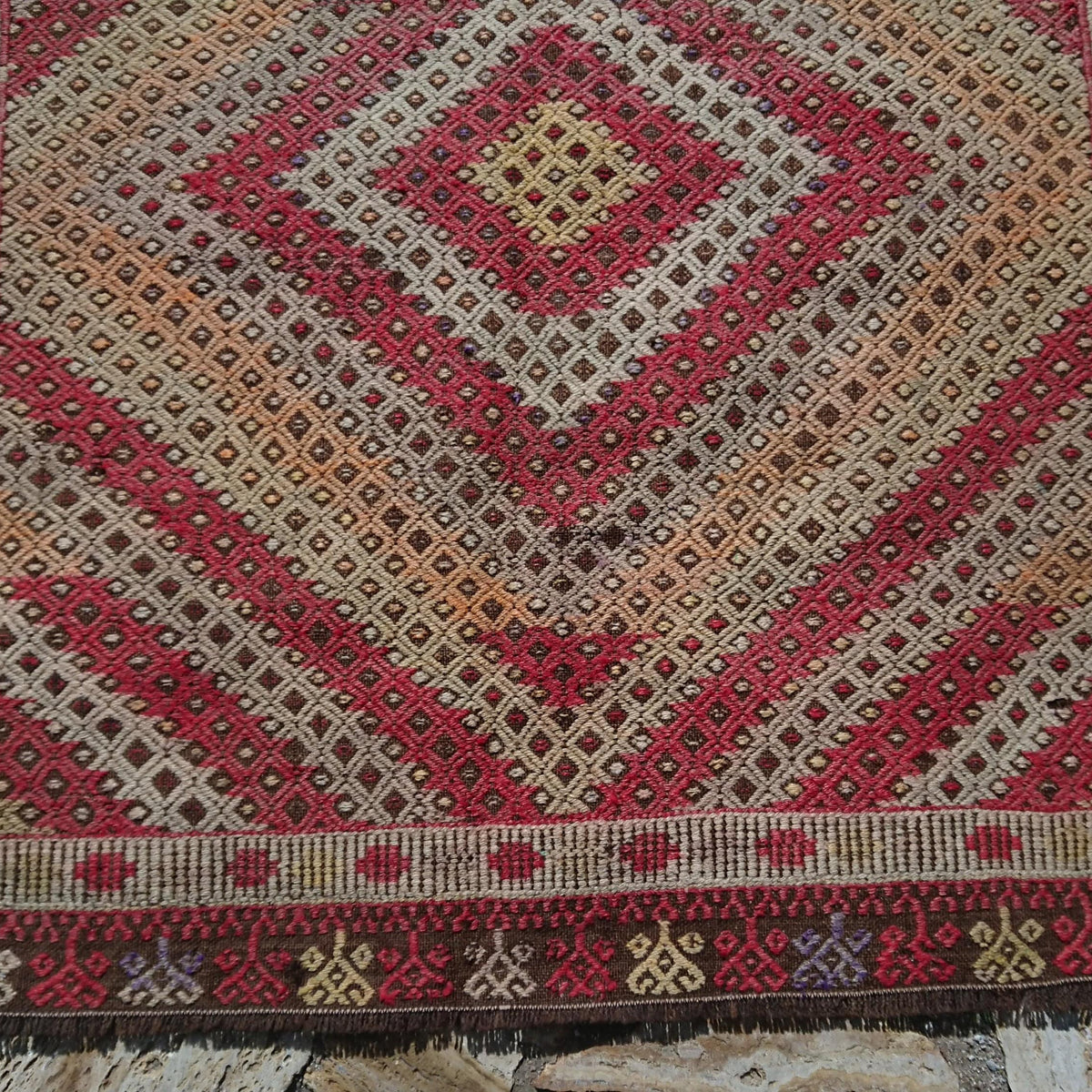 1970s brown vintage Turkish tribal kilim rug with geometric design, flatweave construction and low pile.