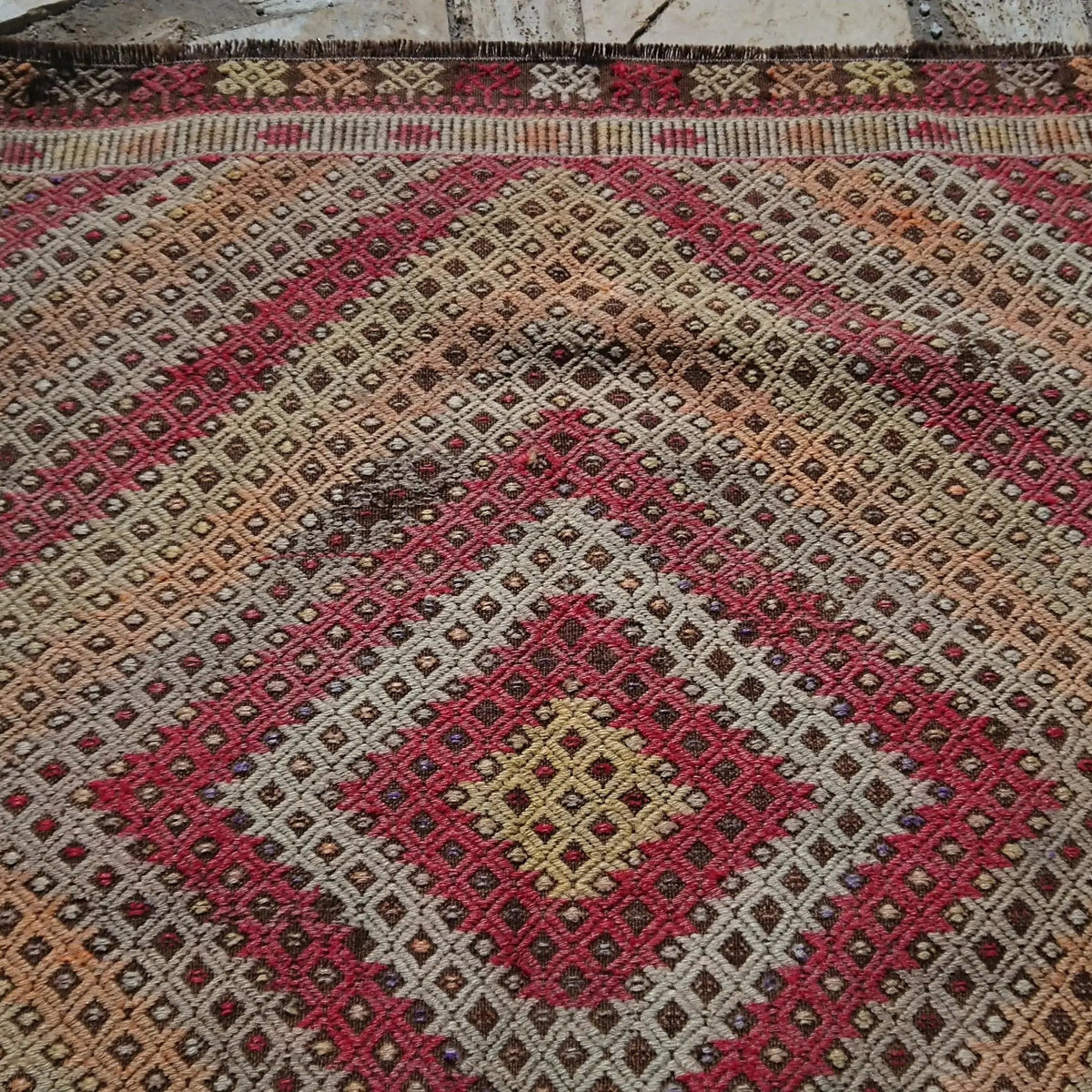 Additional view of the brown vintage Turkish tribal kilim rug with flatweave construction in wool and cotton.