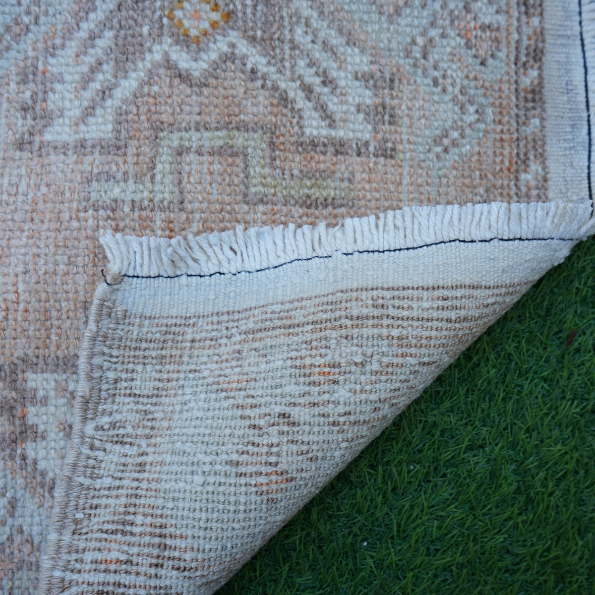 1970s orange vintage turkish rug with traditional design, hand-knotted weave and low pile.