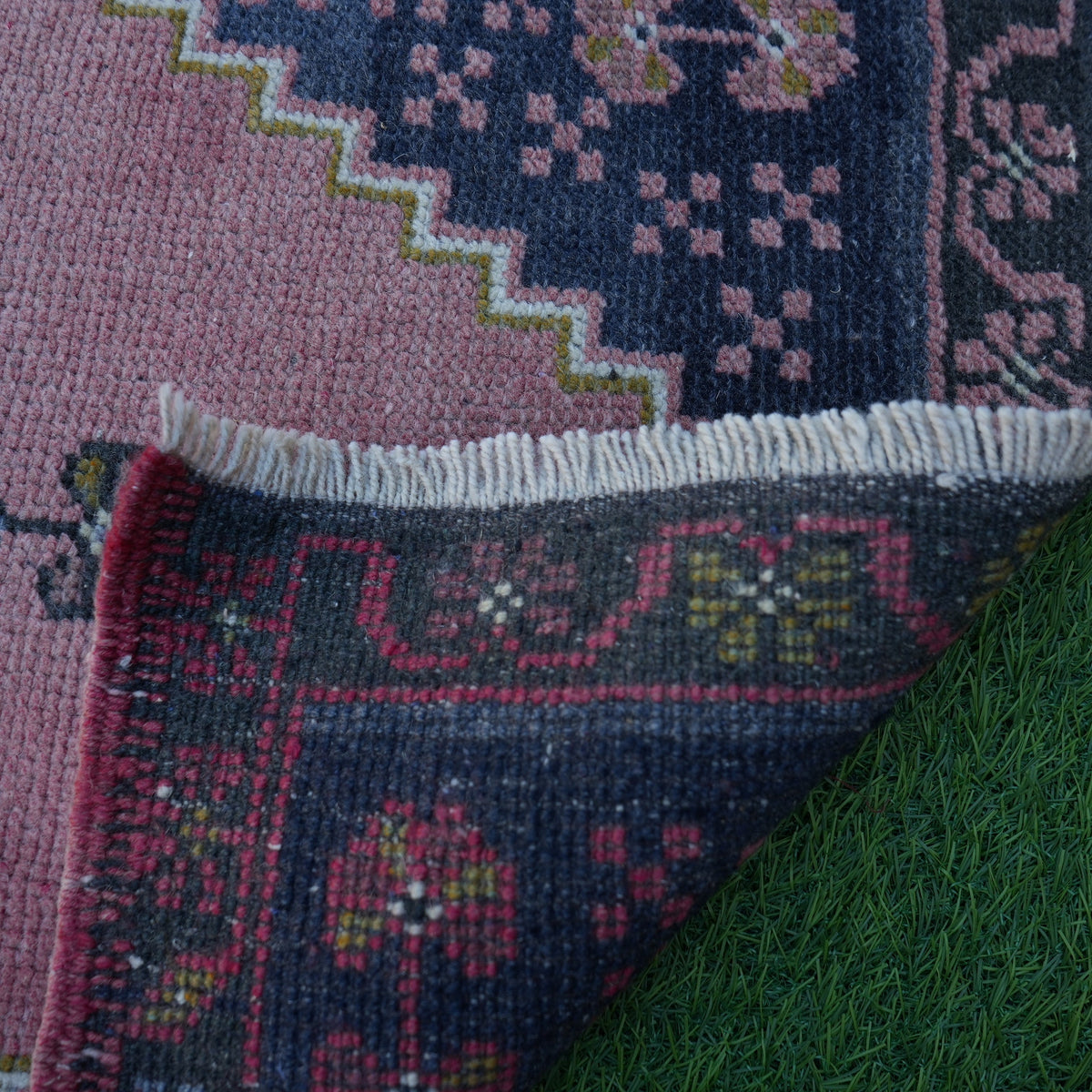 1970s pink vintage turkish rug with traditional design, hand-knotted weave and low pile.