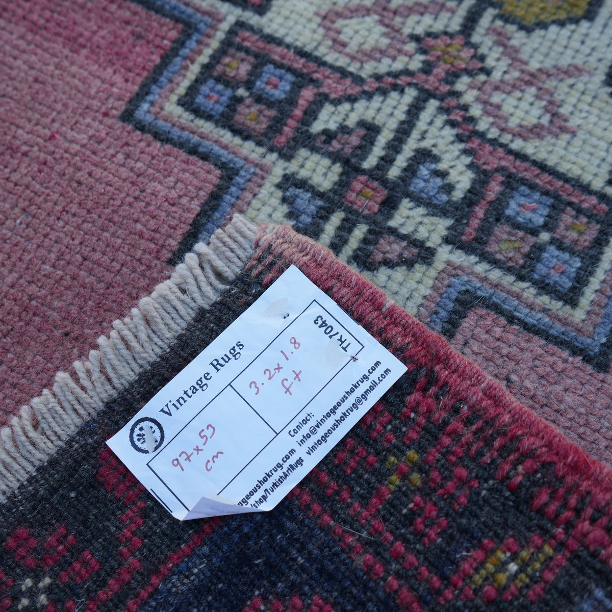 Pink 2' x 3' vintage turkish rug from the 1970s with traditional design.