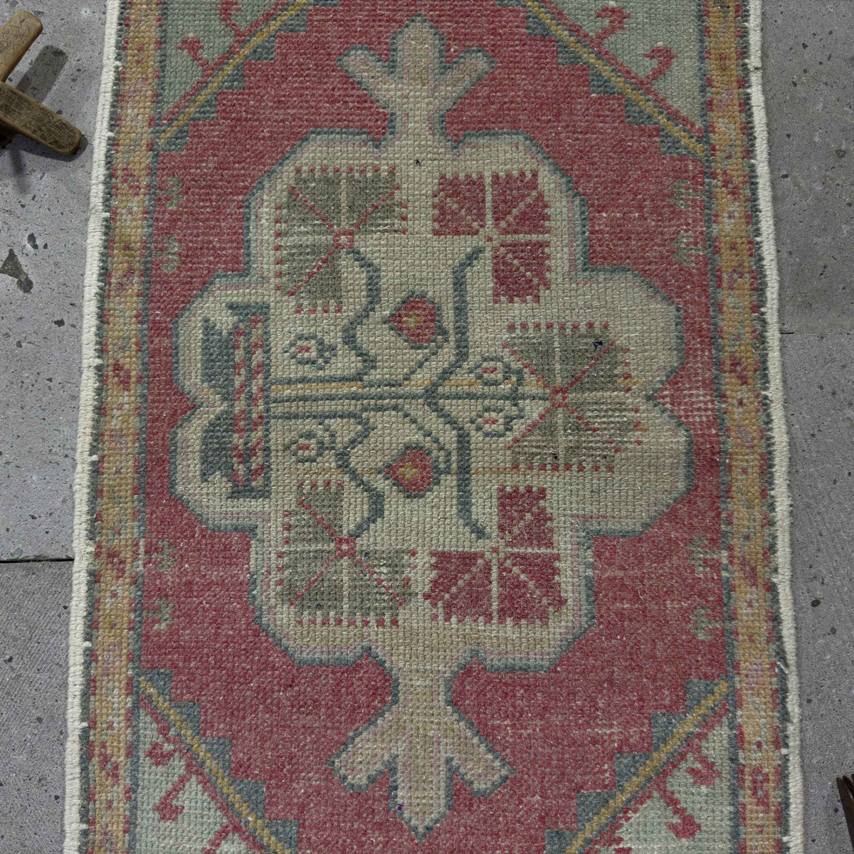 1970s red vintage turkish rug with traditional design, hand-knotted weave and low pile.