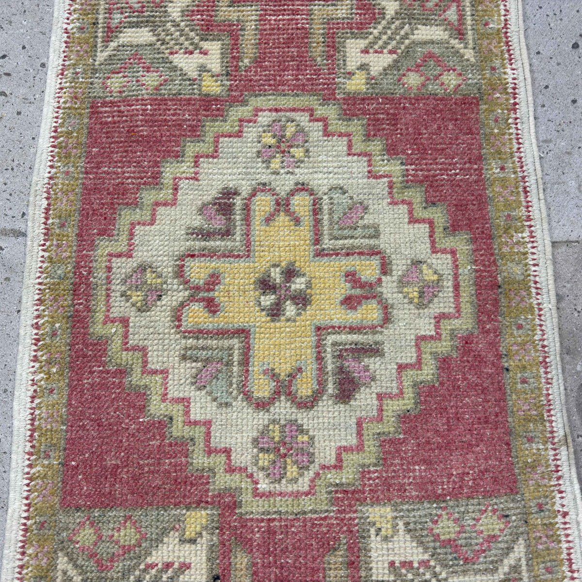 1970s red vintage turkish rug with medallion design, hand-knotted weave and low pile.