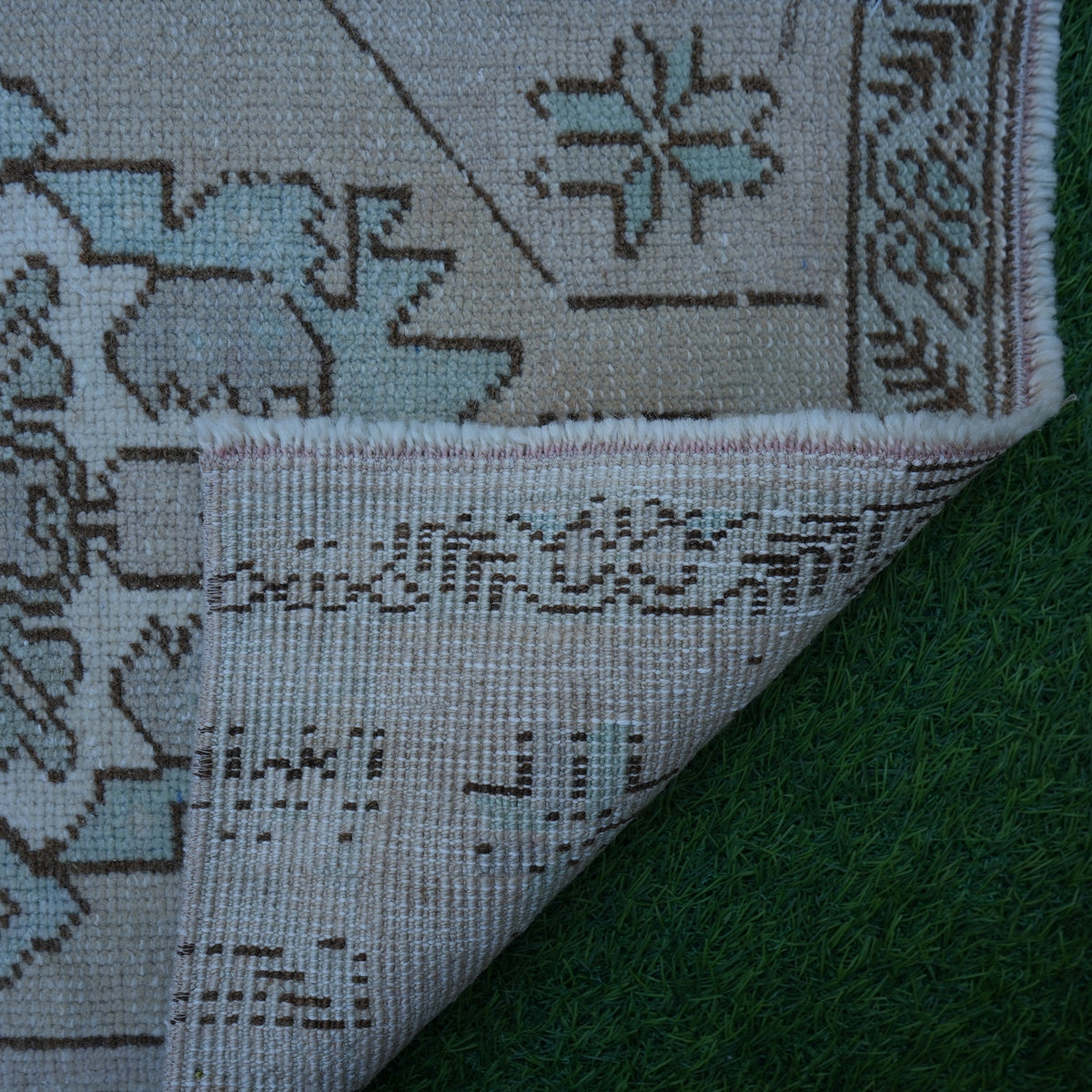 1970s brown vintage turkish rug with traditional design, hand-knotted weave and low pile.