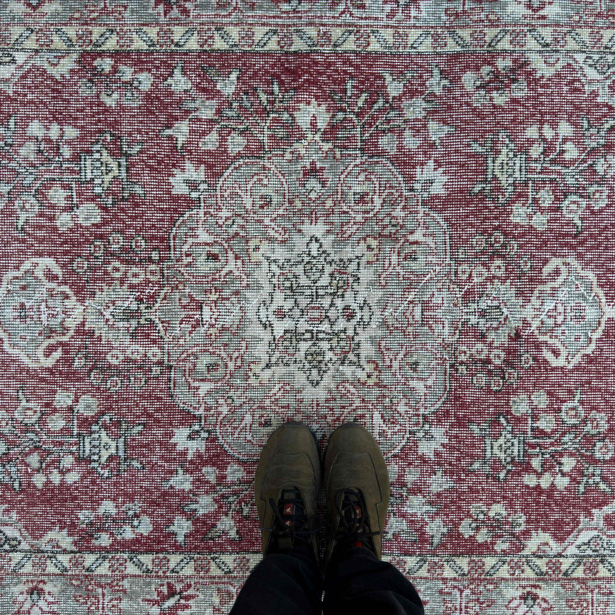 1970s red vintage turkish rug with traditional design, hand-knotted weave and low pile.