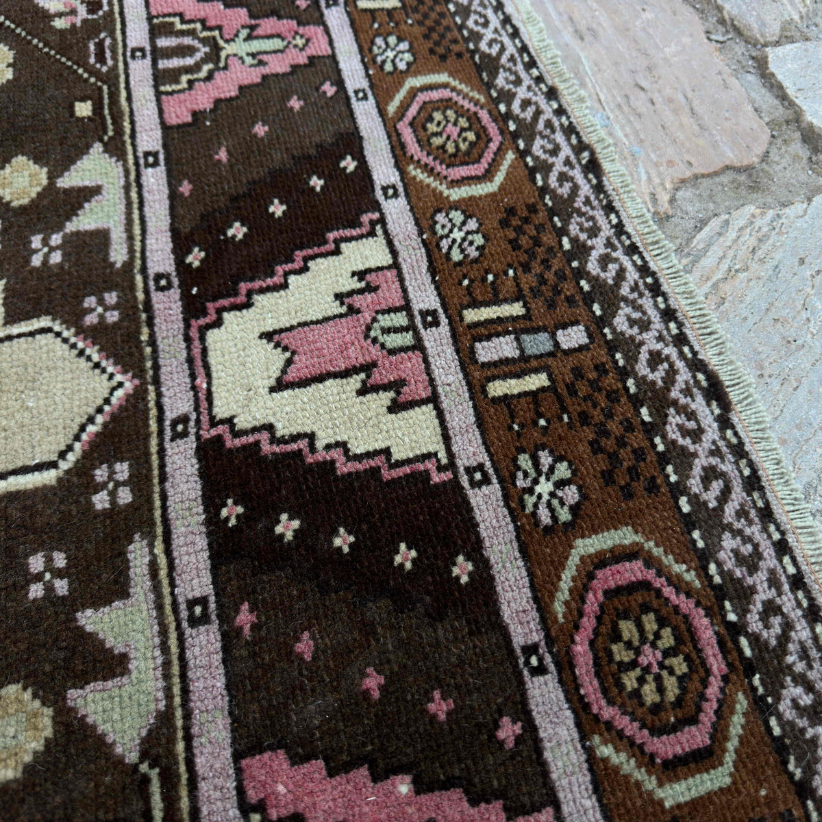 Close-up of the blue vintage turkish rug showing traditional details, hand-knotted weave, wool and cotton and low pile.