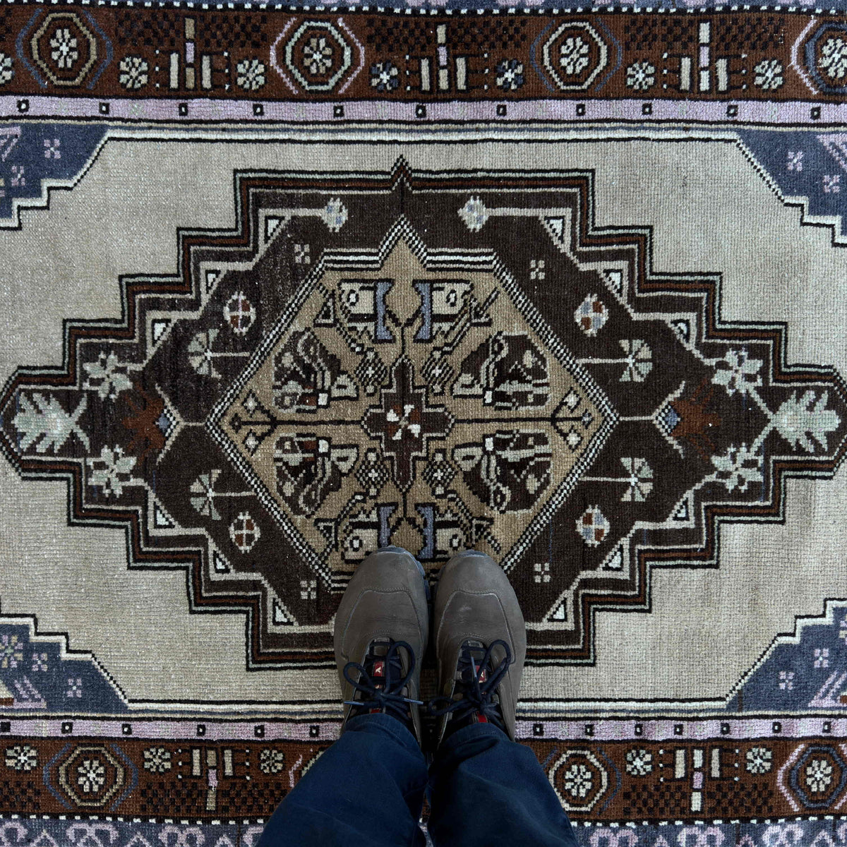 1970s blue vintage turkish rug with traditional design, hand-knotted weave and low pile.