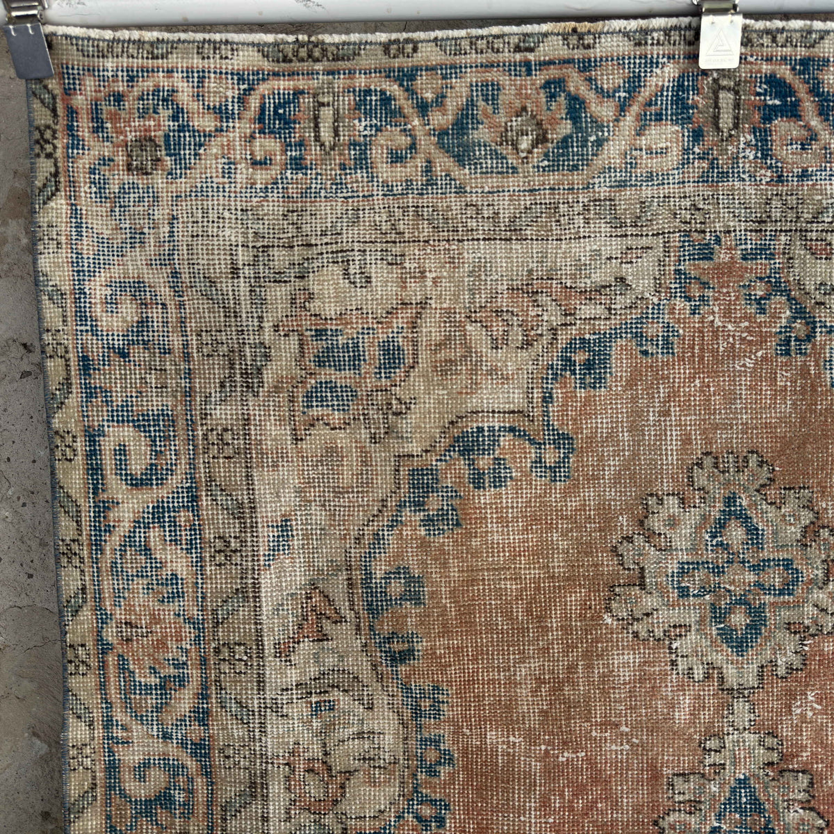 Orange 4' x 6' vintage turkish rug in wool and cotton, shown on the floor.