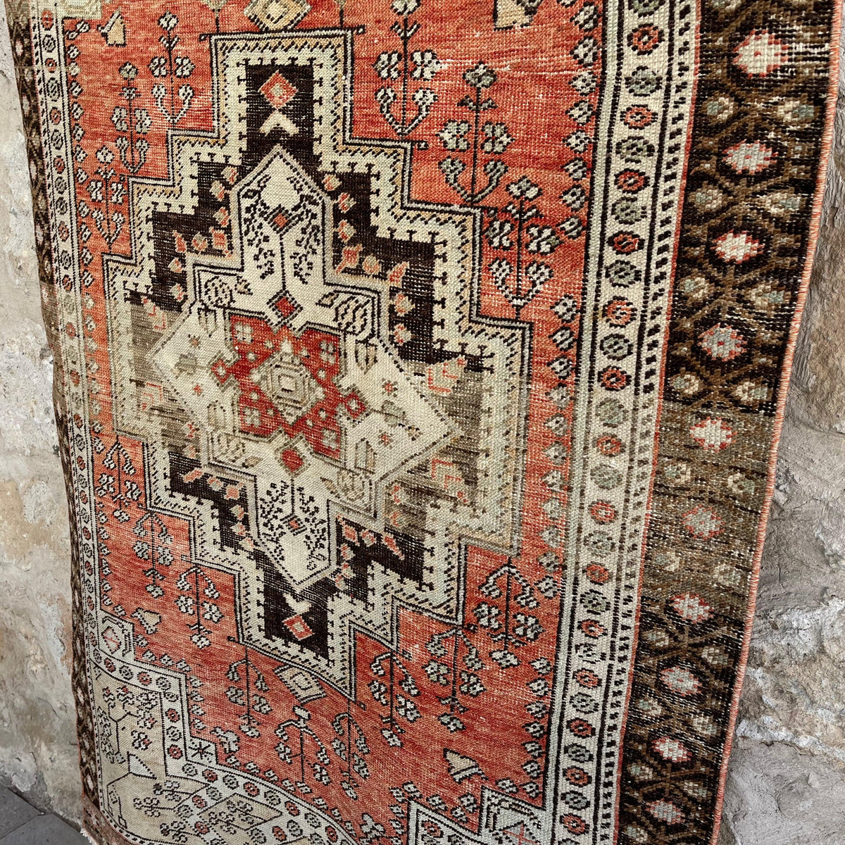 1970s red vintage turkish rug with traditional design, hand-knotted weave and low pile.