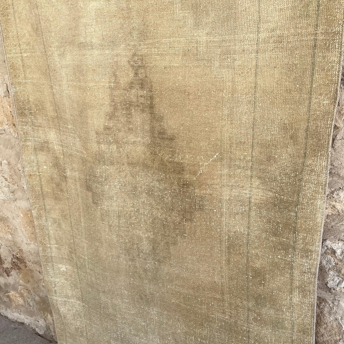 1970s beige vintage turkish rug with neutral design, hand-knotted weave and low pile.