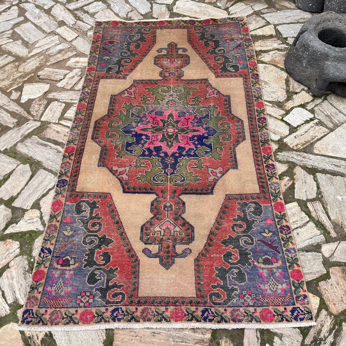 Blue 4' x 7' vintage turkish rug in wool and cotton, shown on the floor.