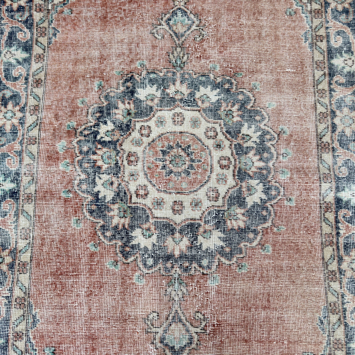 1970s blue vintage turkish rug with medallion design, hand-knotted weave and low pile.