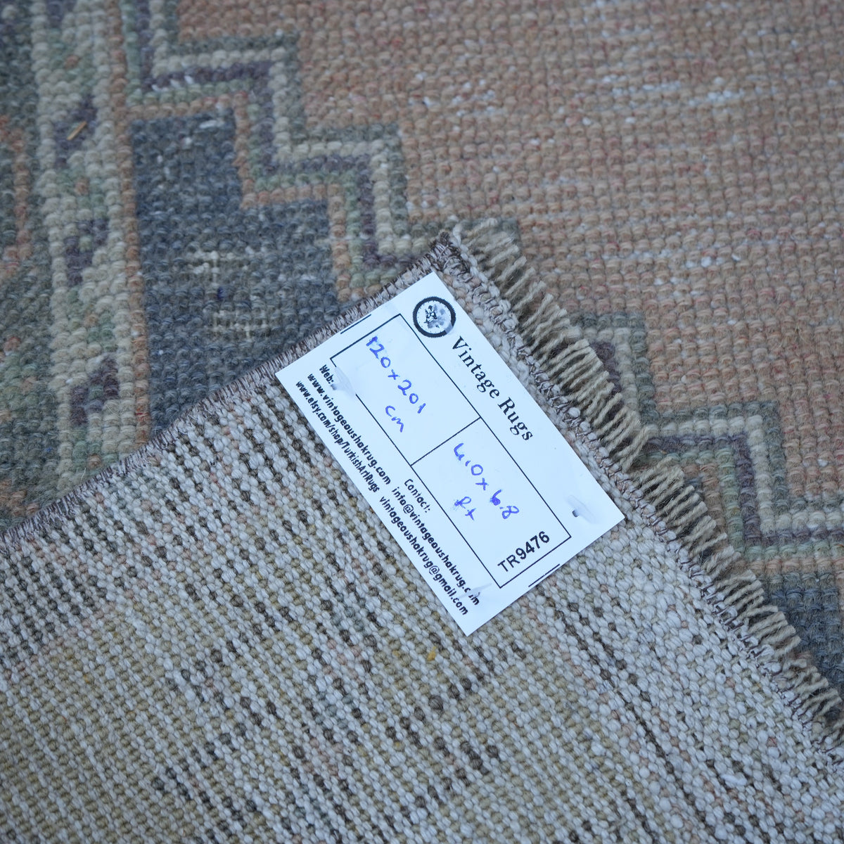 Orange 4' x 7' vintage turkish rug from the 1970s with traditional design.
