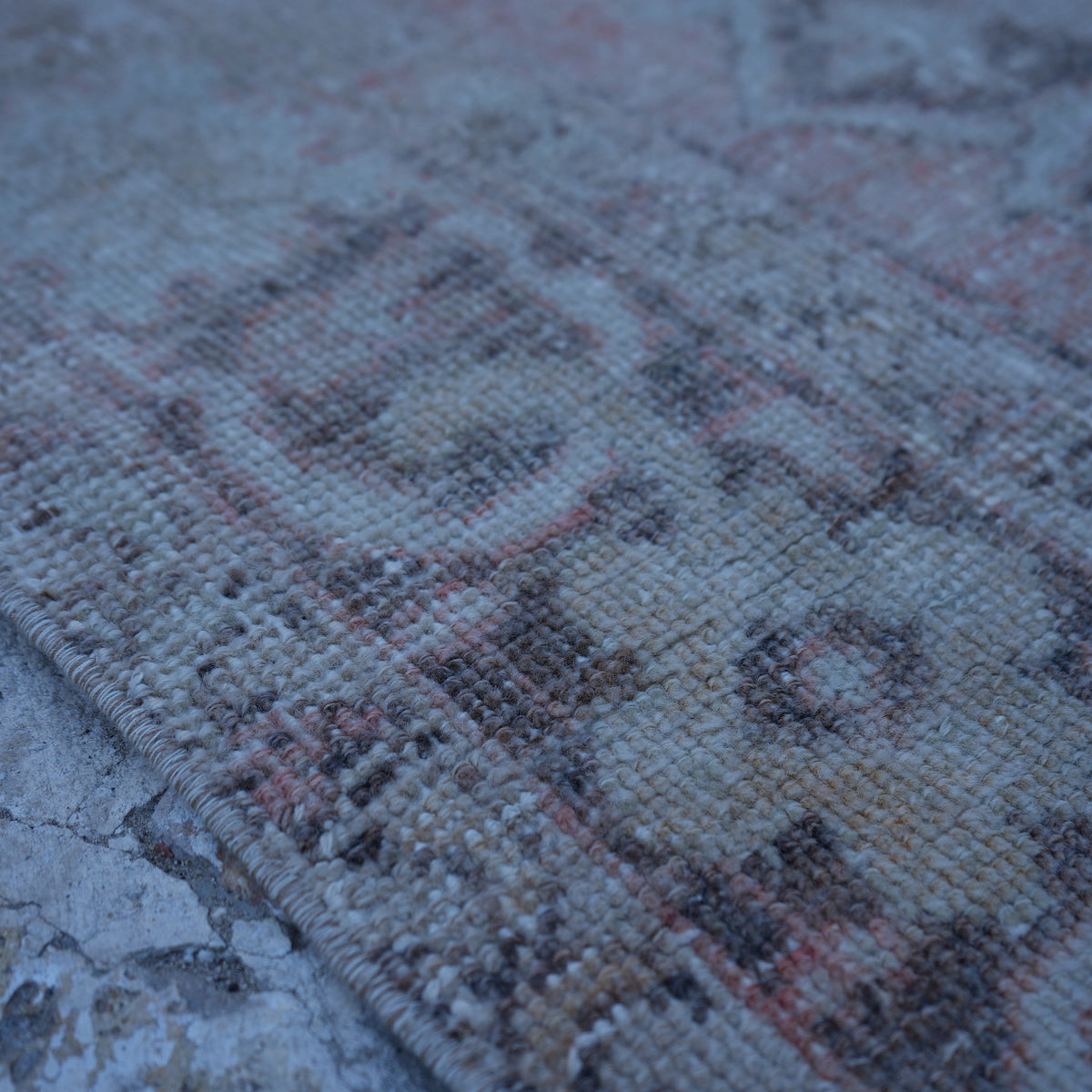 Pale Orange 4' x 7' vintage turkish rug in wool and cotton, shown on the floor.