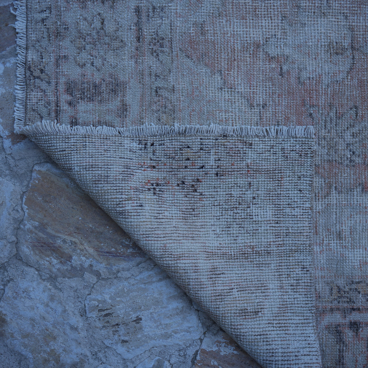 1970s pale orange vintage turkish rug with neutral design, hand-knotted weave and low pile.