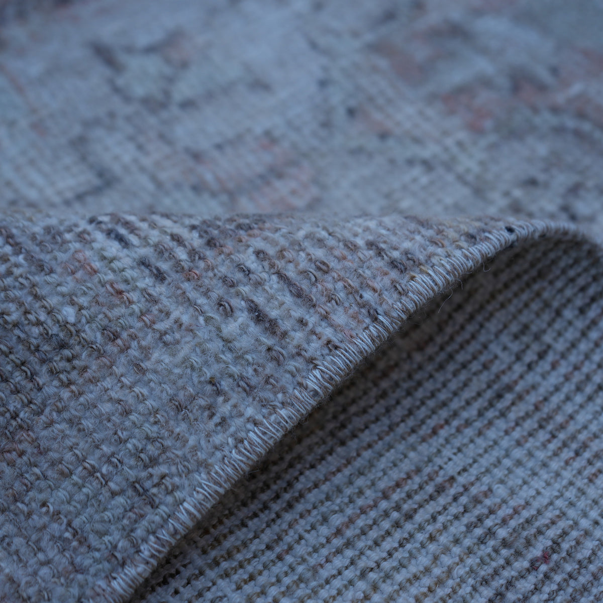 Additional view of the pale orange vintage turkish rug, hand-knotted in wool and cotton.
